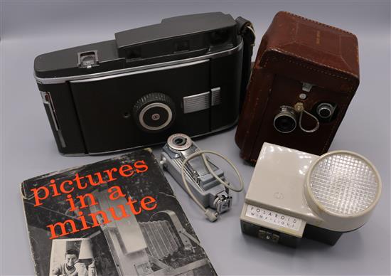 1950s Rolleiflex, serial no. 1283191(cased) & a Polaroid Pathfinder Land camera plus book, accessories, etc.